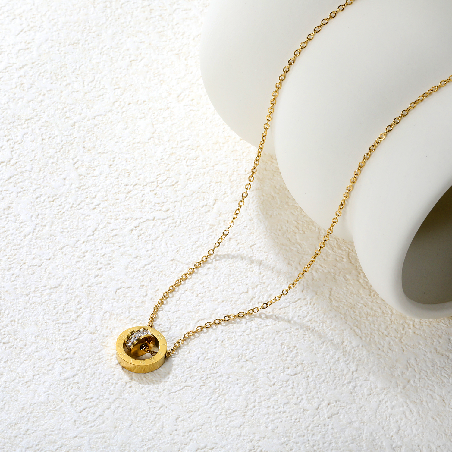 Diamond-set design necklace engraved with Roman numerals, gold