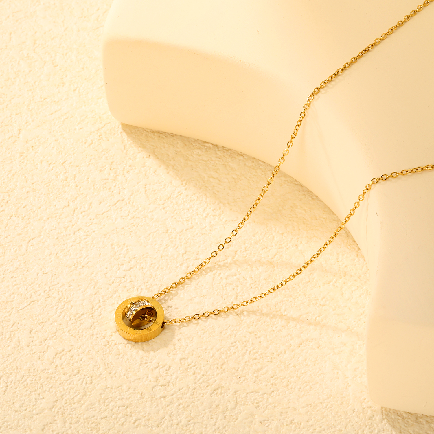 Diamond-set design necklace engraved with Roman numerals, gold